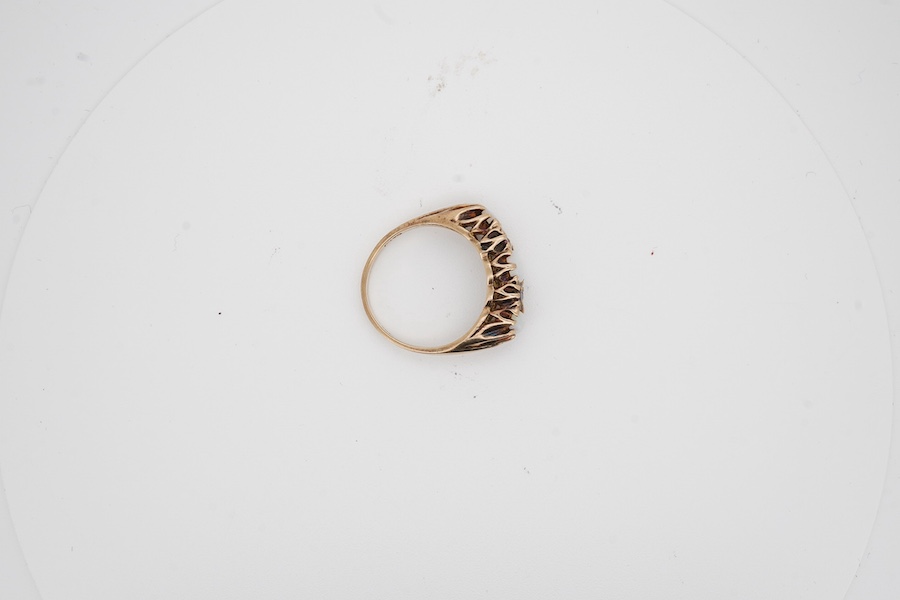 A 9ct, three stone white opal and four stone ruby set half hoop ring, size P, gross weight 4.2 grams. Condition - fair